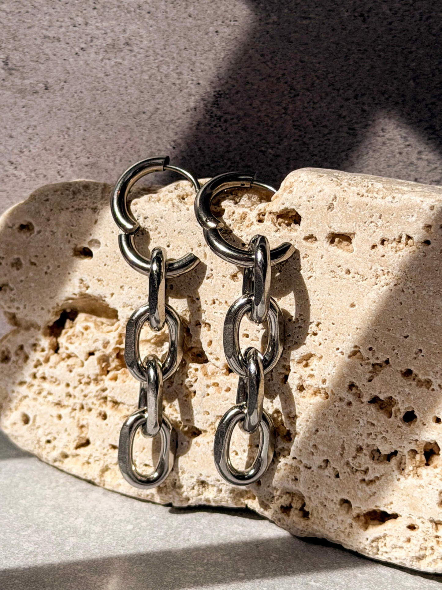 Silver chain link detail on hoop earring