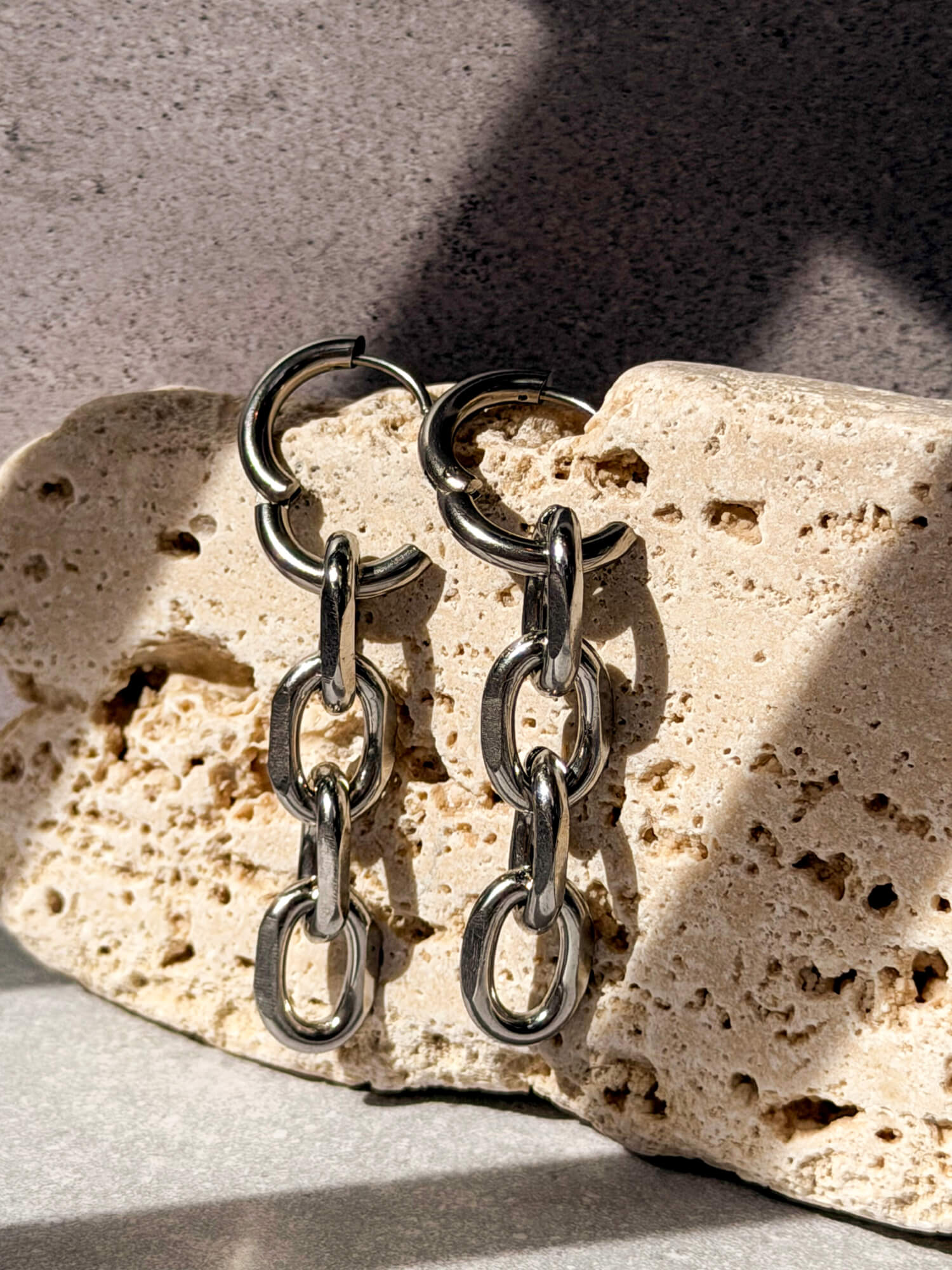Silver chain link detail on hoop earring