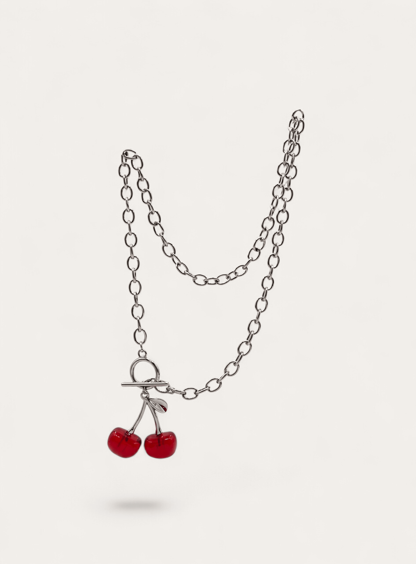 Silver chain necklace with red cherry charm and toggle clasp