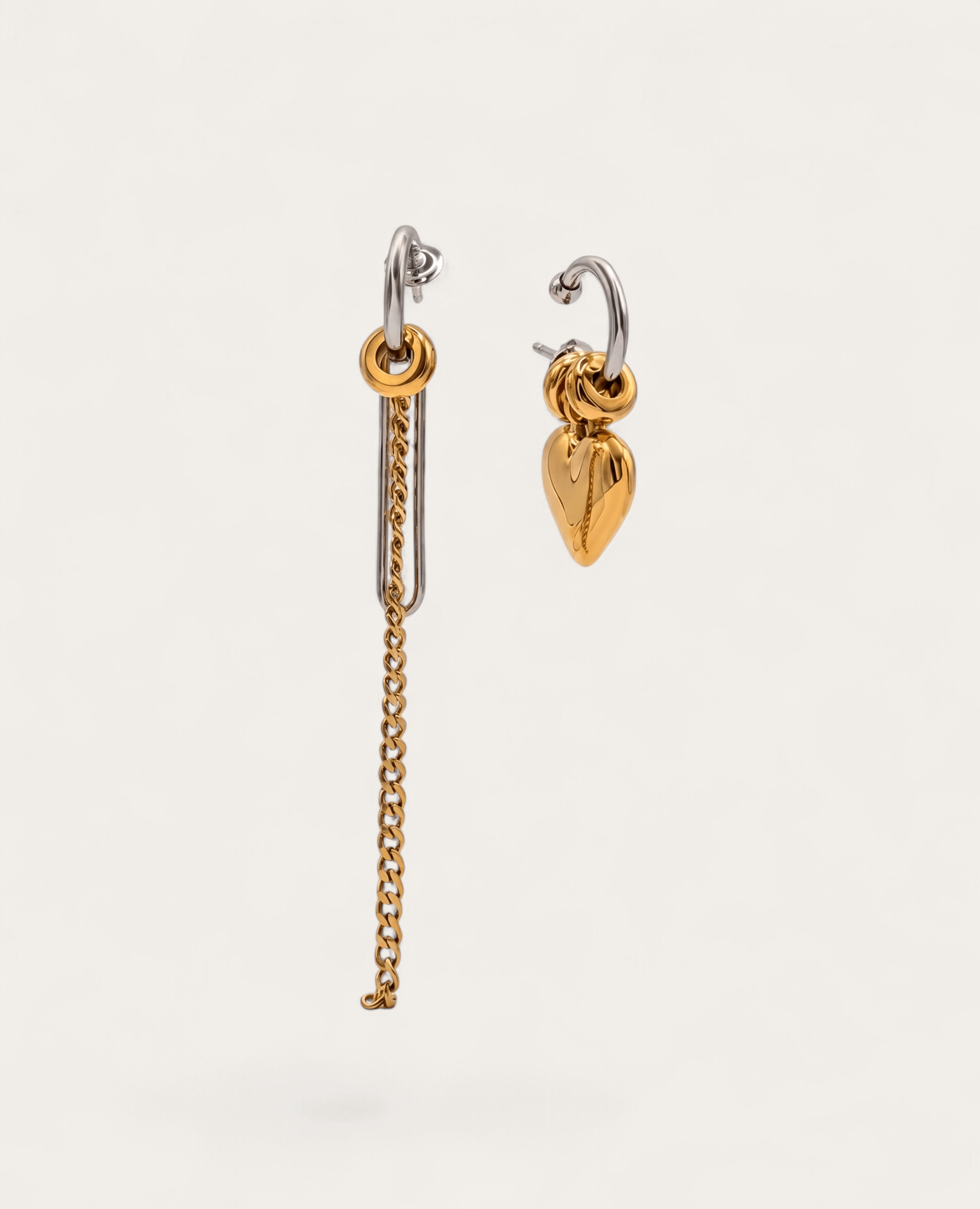 Two-tone mismatched earrings with chain and heart charm drops