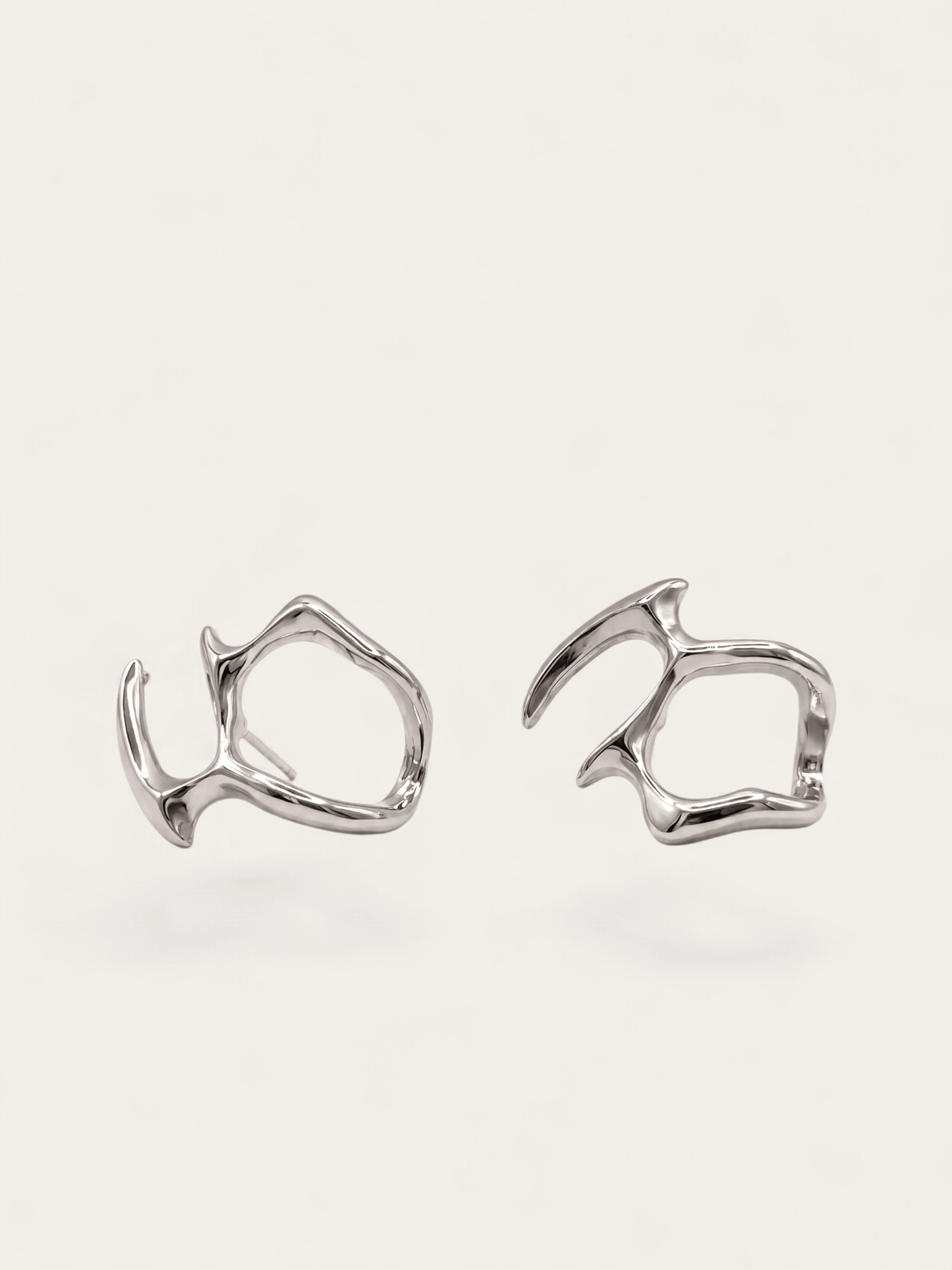 Fluid form silver earrings, abstract sculptural design