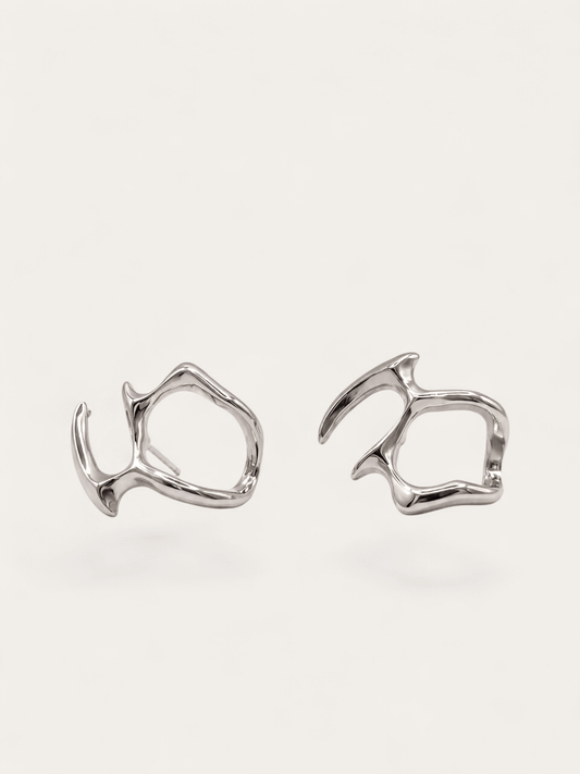 Fluid form silver earrings, abstract sculptural design