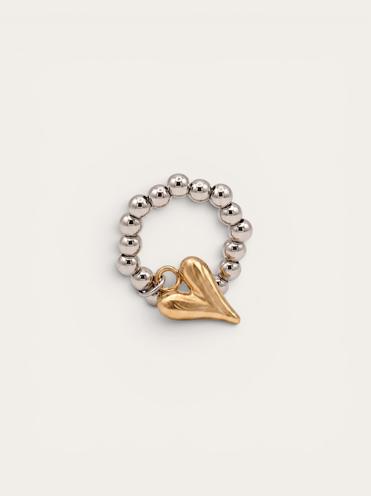 Silver beaded ring with gold heart charm