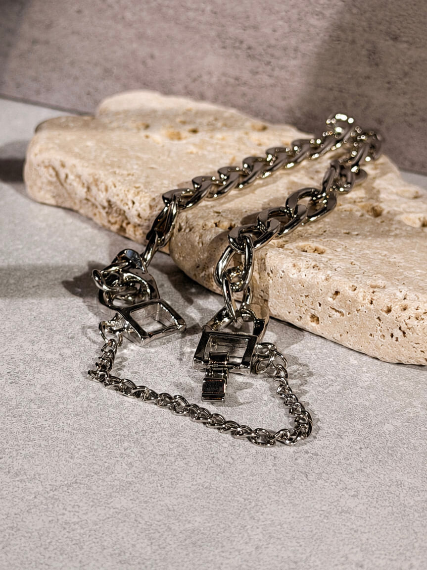 Layered hardware silver bracelet with curb chain and toggle clasp