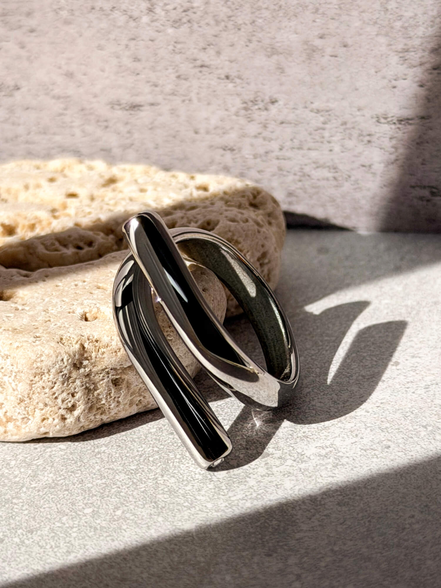 Silver loop ring, asymmetric wrap design with stone detail