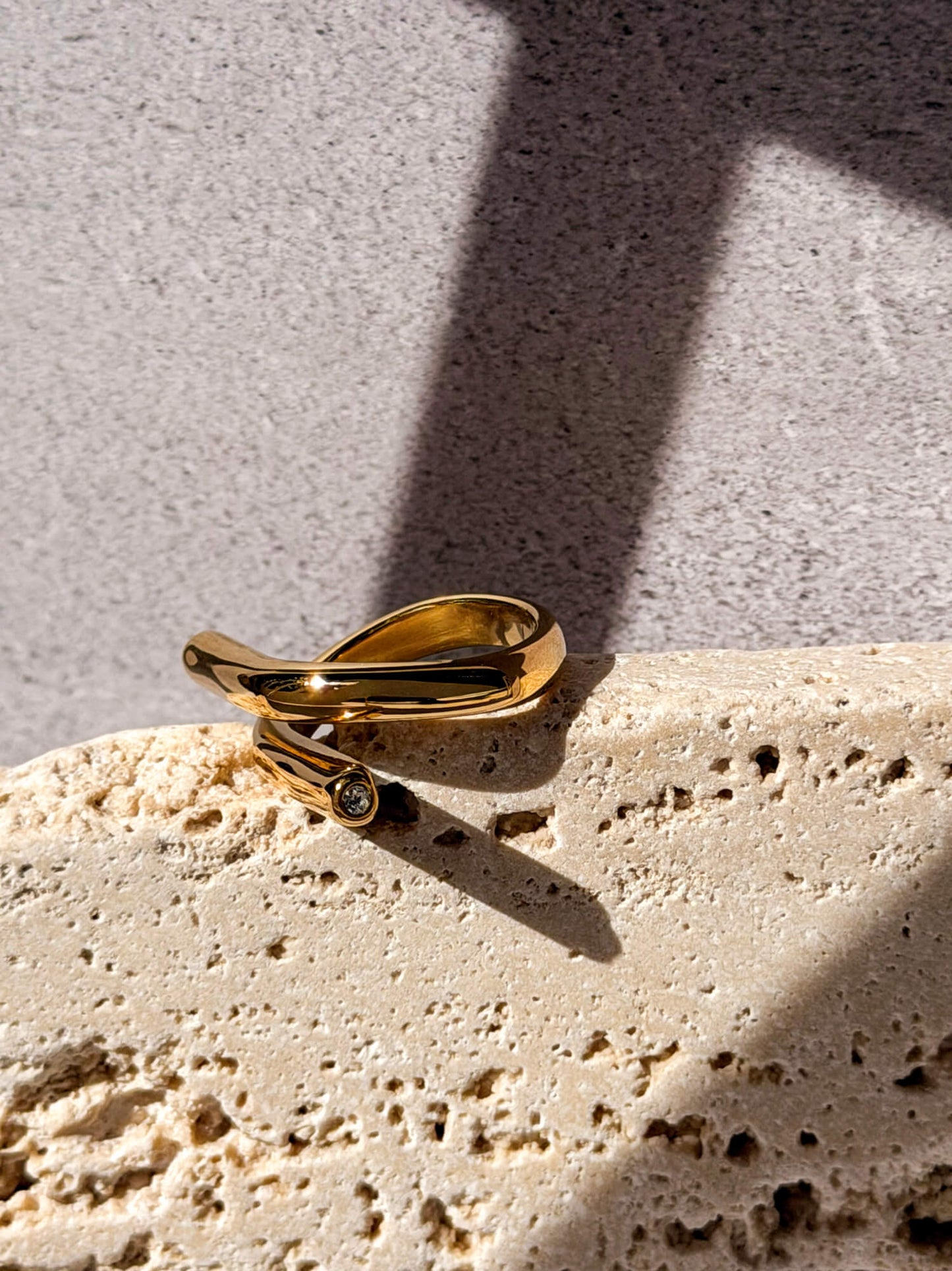 Gold loop ring, asymmetric wrap design with stone detail