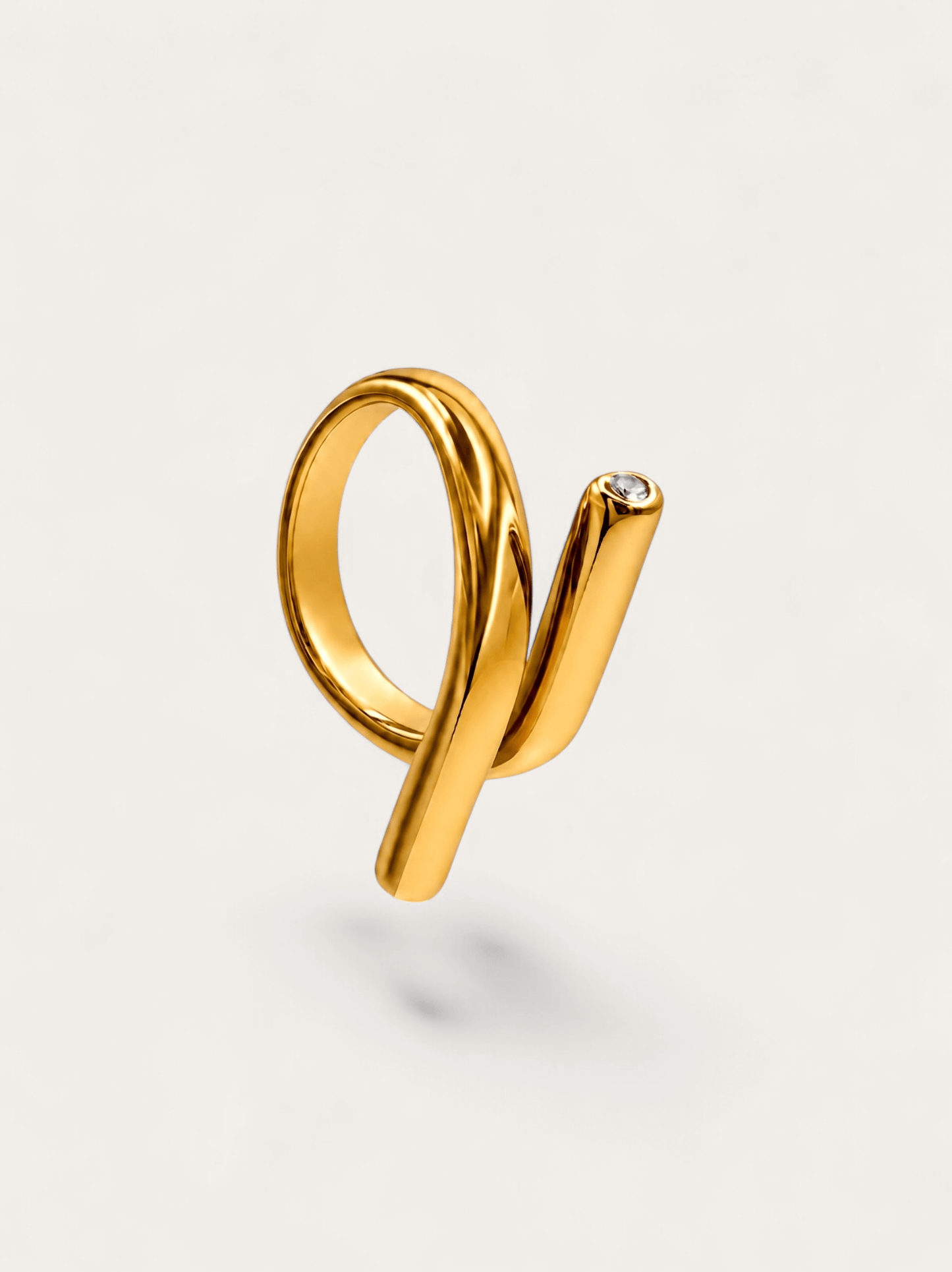 Sculptural wrap gold ring with crystal accent
