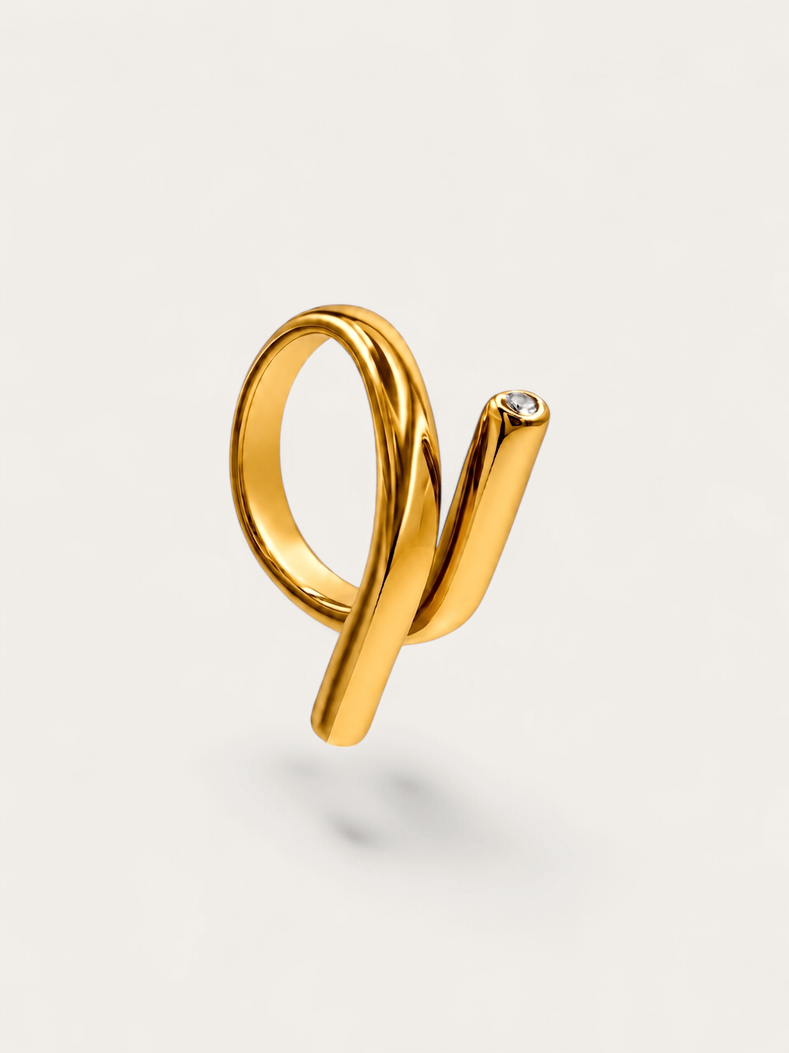 Sculptural wrap gold ring with crystal accent