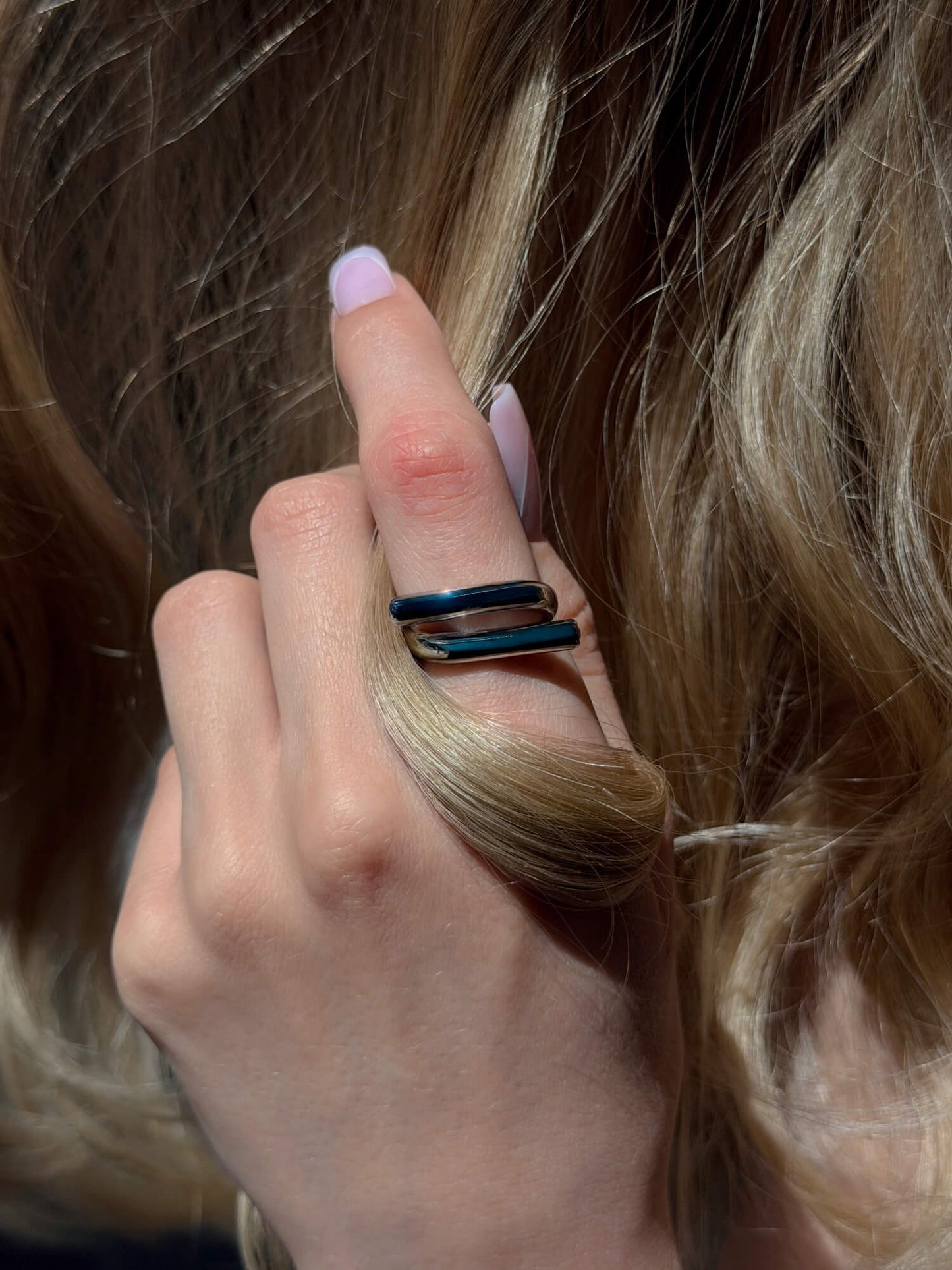 Silver ring crystal accent detail on finger